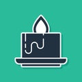 Blue Aroma candle icon isolated on green background. Vector Royalty Free Stock Photo