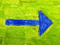 Blue arrow on green background Royalty Free Stock Photo