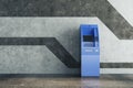 Blue ATM in concrete interior Royalty Free Stock Photo