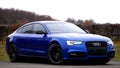 Blue Audi car on street Royalty Free Stock Photo