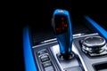 Blue Automatic gear stick of a modern car. Modern car interior details. Close up view. Car detailing. Automatic transmission lever