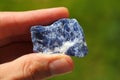 Blue Azurite rock from Morocco held in a hand Royalty Free Stock Photo