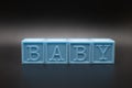 Blue baby blocks on a black background (horizontally) Royalty Free Stock Photo
