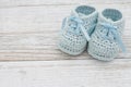 Blue baby booties on weathered wood Royalty Free Stock Photo