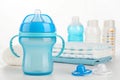 Blue baby cup - baby stuff Royalty Free Stock Photo
