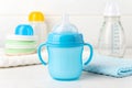 Blue baby cup - baby stuff Royalty Free Stock Photo