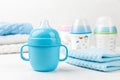 Blue baby cup - baby stuff Royalty Free Stock Photo