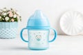 Blue baby cup - baby stuff Royalty Free Stock Photo