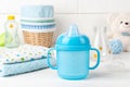 Blue baby cup - baby stuff Royalty Free Stock Photo