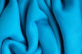 Blue background abstract cloth wavy folds of textile texture Royalty Free Stock Photo