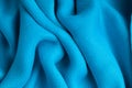 Blue background abstract cloth wavy folds of textile texture Royalty Free Stock Photo