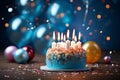 Blue background, birthday cake with candles, balloons, and confetti Royalty Free Stock Photo