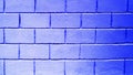 Blue background from brick blocks. Texture of a wall made of large bricks. Copy space. The neon wall is blue Royalty Free Stock Photo