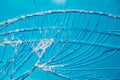 Blue background through the broken window glass. Royalty Free Stock Photo