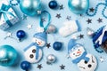 Blue background with christmas balls, felt snowman, mitten and decorations Royalty Free Stock Photo