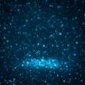 Blue background for christmas navy glitter sparkle. Abstract bokeh light shiny dark holiday.