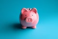 Blue background contrast Pink piggy bank, simple and vibrant