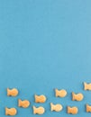 Blue background cookies salted fish shape