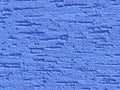 Blue background facade plaster . Monolithic plaster decorative backdrop. Single layer scraped cement plaster wallpaper. Sand exter