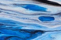 Blue background of flowing paints