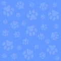 Dog paw. Blue background and light blue dog tracks. Pattern with traces. Royalty Free Stock Photo