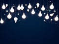 Blue background with many white light bulbs hanging from the ceiling Royalty Free Stock Photo
