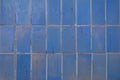 Blue background old ceramic tiles.