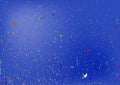 Blue background with scattered colorful particles.