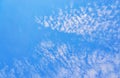 Blue background with spots of white clouds