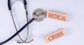 On a blue background, a stethoscope and wooden block with the word PROLAPSE .Medical concept