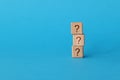 On blue background, there is pyramid of cubes with question mark Royalty Free Stock Photo