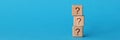 On blue background, there is pyramid of cubes with question mark Royalty Free Stock Photo