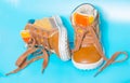 On a blue background, two children`s Shoe Royalty Free Stock Photo