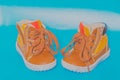 Two children`s Shoe on a blue background Royalty Free Stock Photo