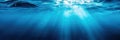 blue background with underwater water in sea and the rays of the sun through the surface Royalty Free Stock Photo