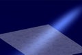 Blue background with white beam illumination and gray color plane in the dark.