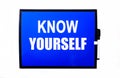 On a blue background a white inscription KNOW YOURSELF Royalty Free Stock Photo