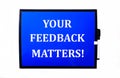 On a blue background a white inscription YOUR FEEDBACK MATTERS