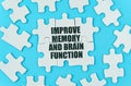 On a blue background are white puzzles with the inscription - Improve memory and brain function