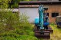 Blue backhoe in Shirakawa-go