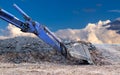 Blue backhoe shovel on the ground stone road with cloudy sky as a backdrop