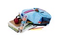 Blue backpack full of supplies on white Royalty Free Stock Photo
