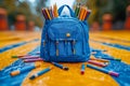 Blue Backpack Overflowing with Colorful Pencils on textured Yellow and Blue Surface Royalty Free Stock Photo