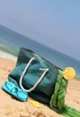 Blue bag on the seacoast with lollipop