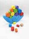 Blue balance toy with colored cilinders Royalty Free Stock Photo