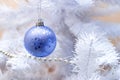 Blue ball hanging on silver christmas tree, good as background Royalty Free Stock Photo