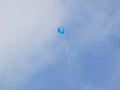 Blue balloon floating away - escape