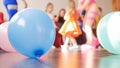 Blue balloon and group of kids on the background Royalty Free Stock Photo