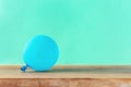 Blue balloon wooden table copy space Party background