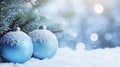 Blue balls on fir branches, winter snowy background. festive winter season background, copy space. Royalty Free Stock Photo